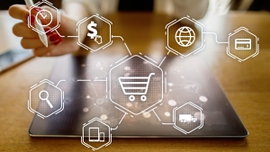 An image of a tablet with icons overlaid; magnifying glass, globe, shopping cart, money, truck